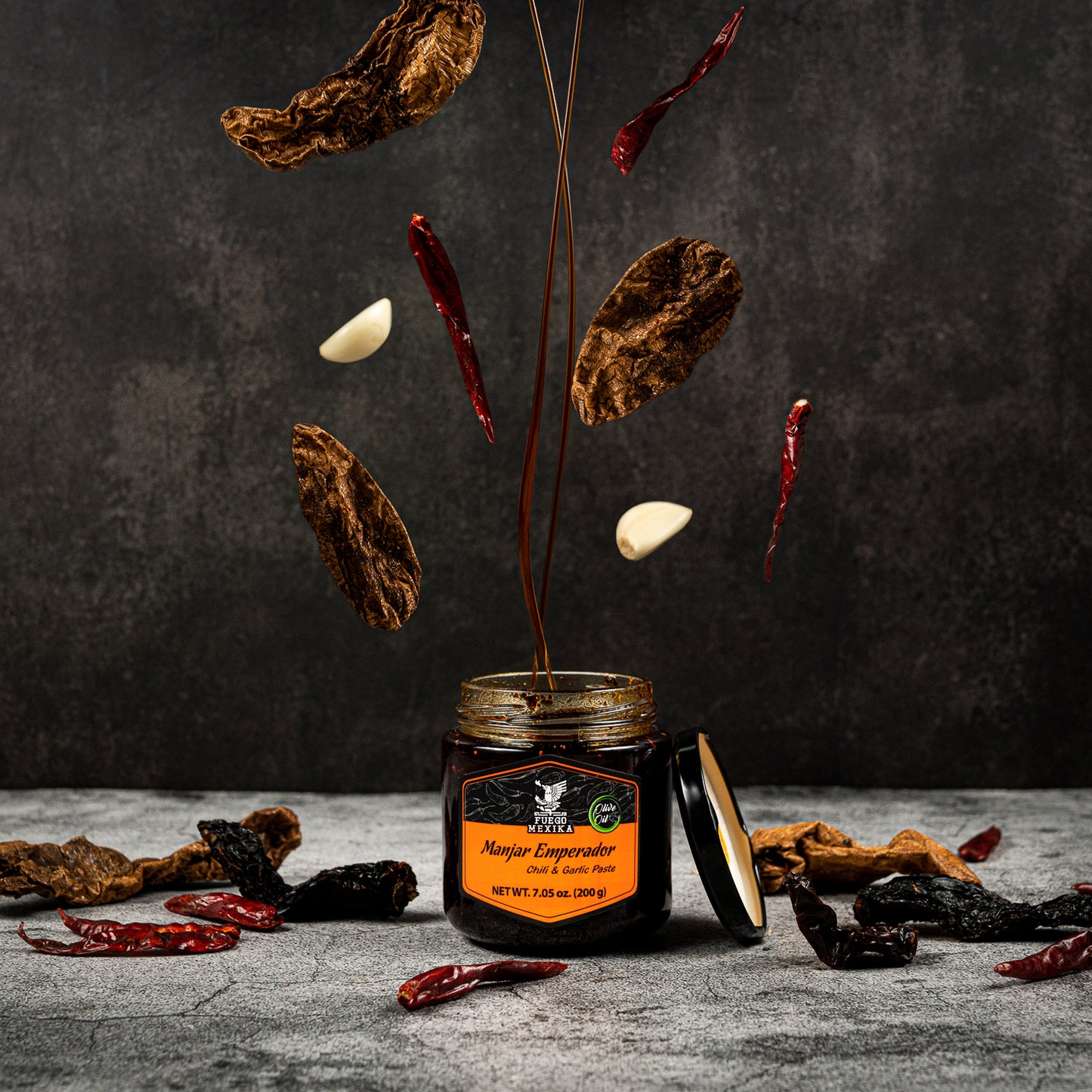FUEGO MEXIKA - Manjar Emperador 24-unit Box | Premium Salsa Macha: roasted Chipotle, Morita & Rojo de Arbol peppers with Garlic bathed in virgin olive oil.